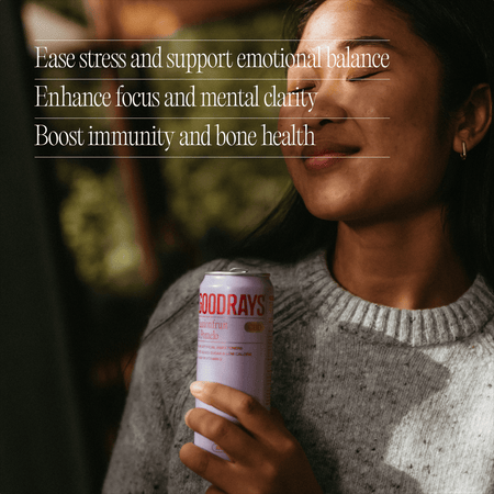 Person holding a can of Goodrays with text about health benefits.